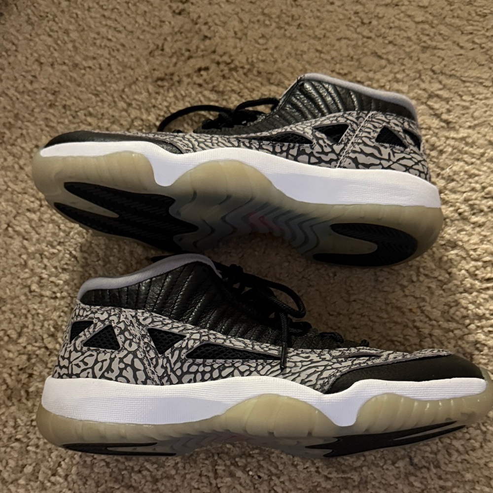 Jordan 11 low IE Black Cement